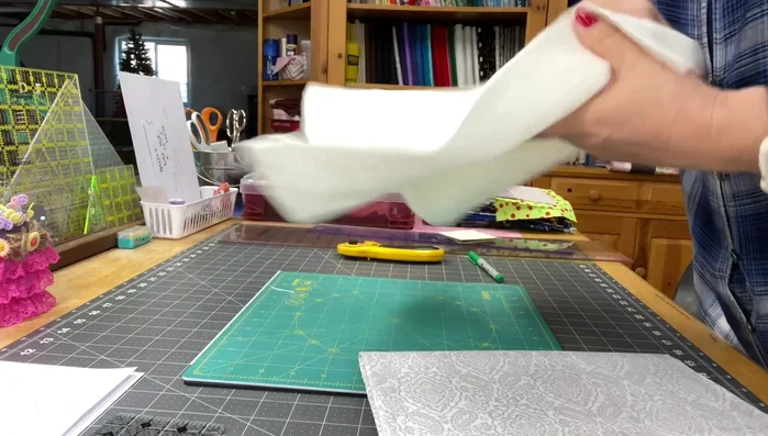 Cut three 3.5 inches wide fabric strips for pockets.