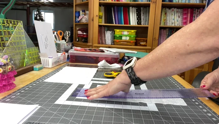 Fold the handle strip in half lengthwise and press. Fold it in half again, press, and stitch to secure.