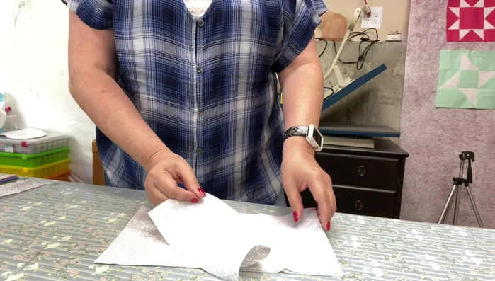 Press (don't iron!) the fabric pieces to remove wrinkles. Pressing prevents stretching.