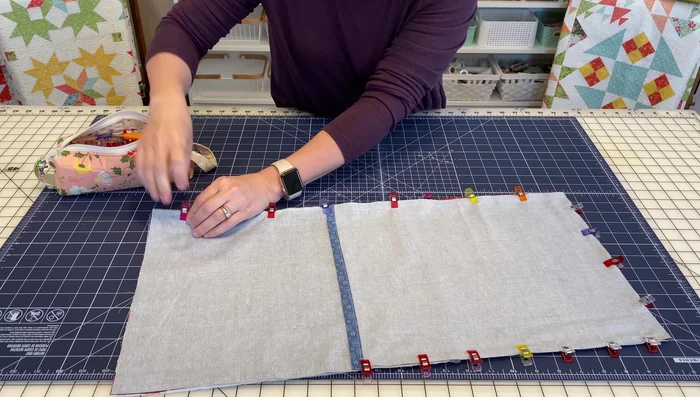 Sew all around the pillow with a ¼-inch seam allowance. Note: A slightly larger seam allowance (½ inch) is recommended for some pillows for extra stability but not needed in this case. Sew with the pillow front on top to help guide the fabric and ensure all edges are within the seam allowance.