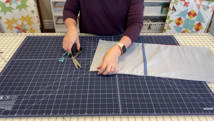 Clip the corners to reduce bulk. Be careful not to cut the seam.