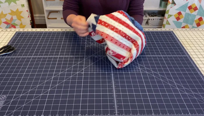 Turn the pillow right side out. Use fingers or a corner tool to push out the corners neatly.