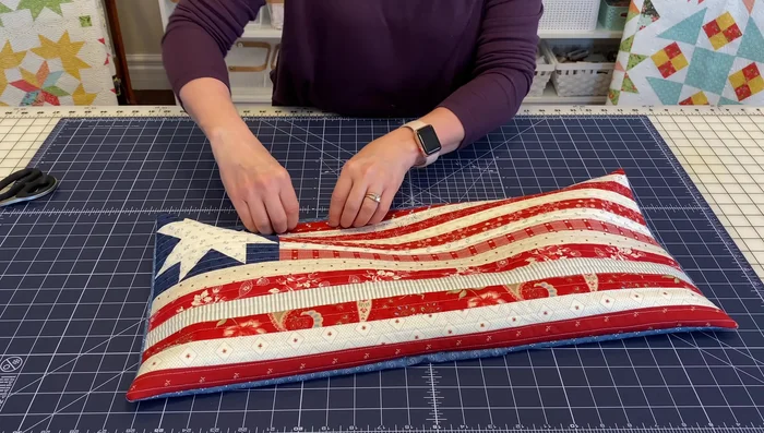 Press the pillow from the front to create a crisp finish and prevent the pillow back from showing through.