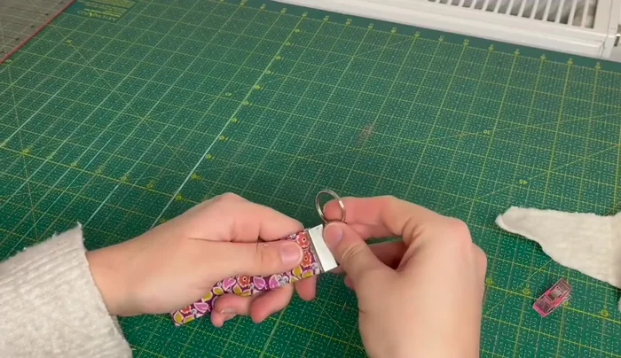 Add a piece of wadding (optional) and fully close the tab using pliers.