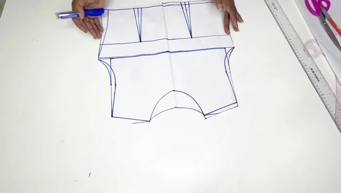 Cut out the armhole and neckline of the front pattern.