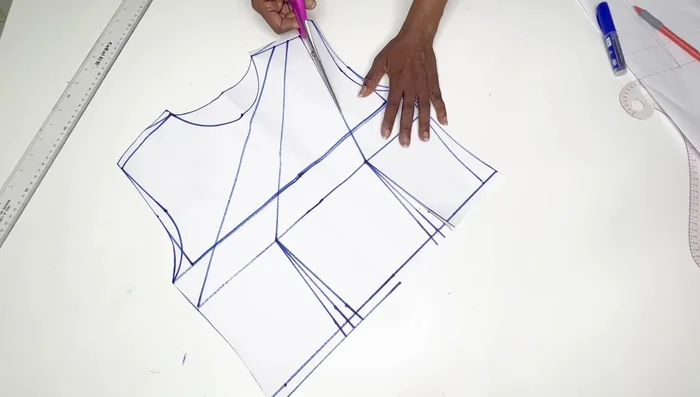 Cut out the armhole and neckline of the front pattern.