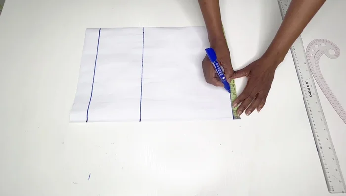 Place half your shoulder measurement on the starting line. Go down by an inch and connect to the neck width to form the shoulder line.