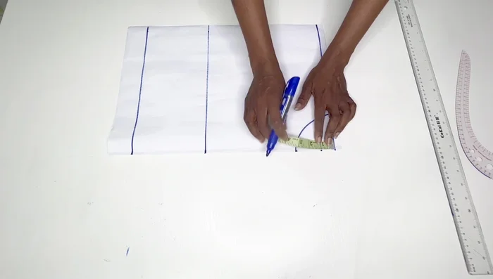 Place half your shoulder measurement on the starting line. Go down by an inch and connect to the neck width to form the shoulder line.