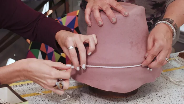 Use a pointed tool to define the crown-brim juncture.