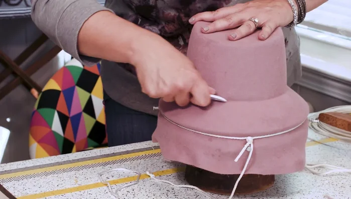 Use a pointed tool to define the crown-brim juncture.