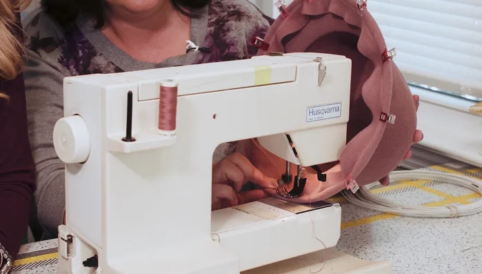 Decorate and embellish the hat. (Trimming)