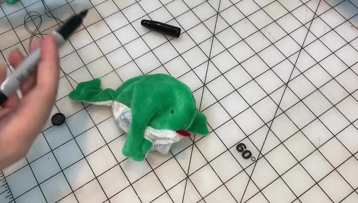 Attach buttons for the eyes.