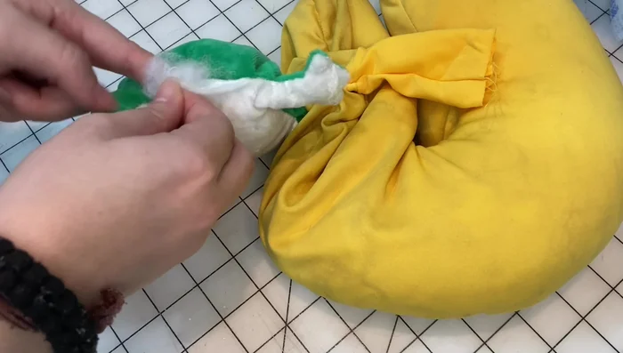 Attach buttons for the eyes.