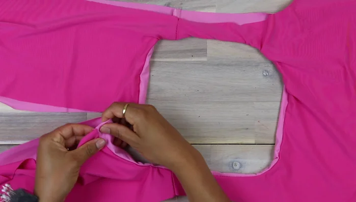 Trim seam allowance, push towards facing, and understitch with zigzag stitch.