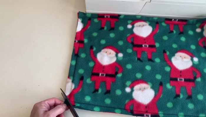 Press the stitched sides. Press one inch in on the notched side.