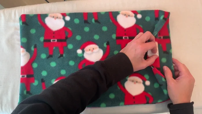 Press the stitched sides. Press one inch in on the notched side.