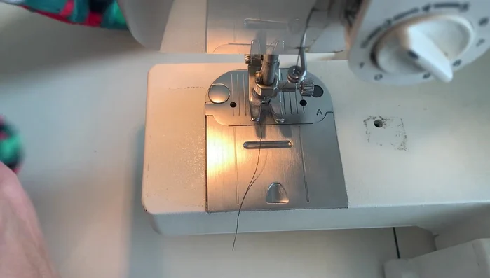 Stitch along the existing stitch line on the exterior of the pillowcase to attach the ties securely.