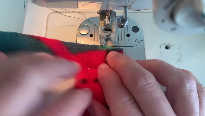 Press the stitched sides. Press one inch in on the notched side.