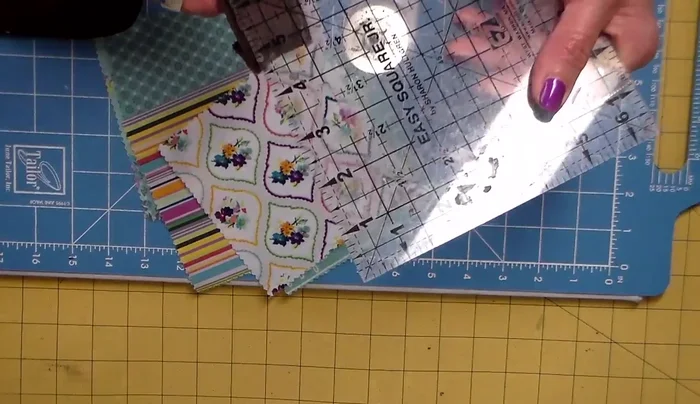 Cut fabric scraps into strips, adding 1.25 inches to the width of the belt for each strip. Pink the edges of the fabric.