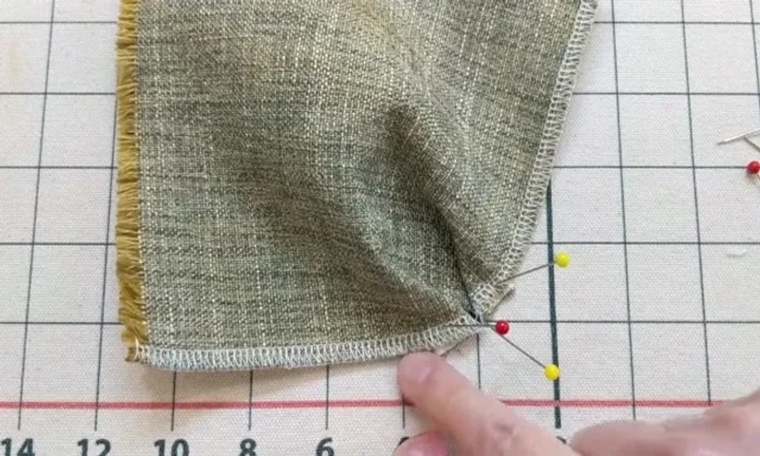 Pin the pleats in place to secure them before sewing (optional, but recommended for beginners).