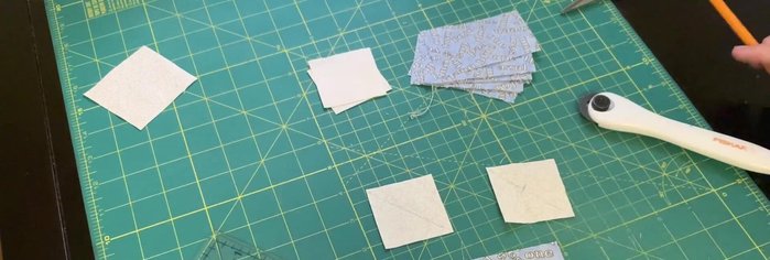 Draw a pencil line along the diagonal where the squares overlap.