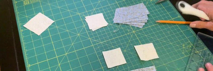 Cut two 2-inch squares for the geese.