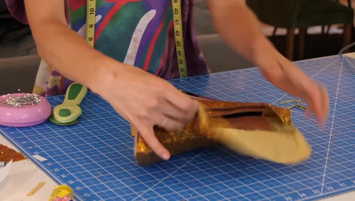 Create an overlap to cover the zipper.