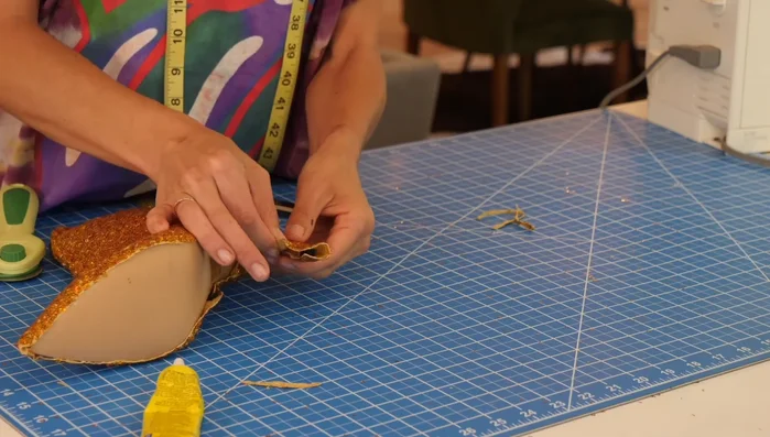 Trim all edges using small, precise scissors. (If you properly lined up the fabric edges with the boot sole in Step 9, this step can be minimized.)