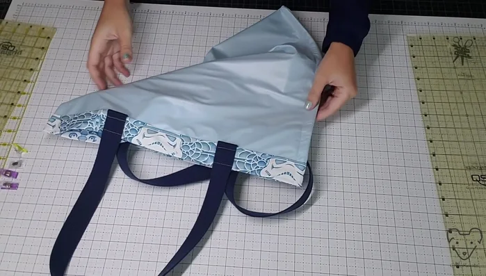 Box the corners by cutting off the excess fabric and sewing the corners.