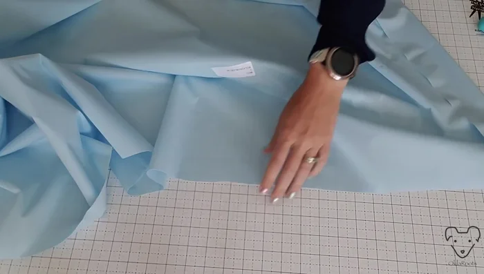 Press the pull fabric lining using low heat and steam. (Note: The narrator had difficulty with this step and suggests experimenting with dry pressing on low heat if steam doesn't work well)