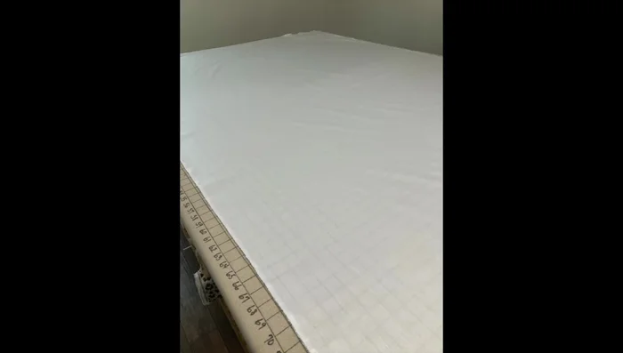 Hem deck fabric: Create a double half-inch hem on the top edge (headboard end) of the deck and topstitch.