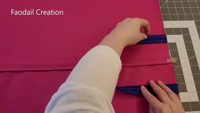 Attach the handles to the back section of the kneeling cushion, with the handle facing in. Pin in place and sew.