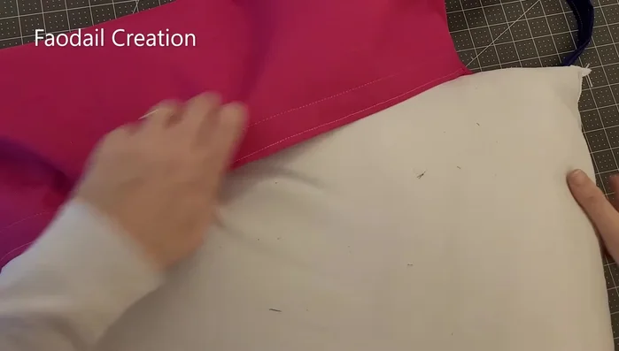 Turn the cushion right sides out. Insert the pillow and close the velcro.