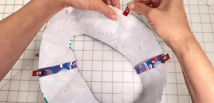 Sew brim: Stitch brim pieces together (right sides together) with a 1/4 inch seam allowance. Turn right side out, roll seam, press, and pin to prevent twisting.