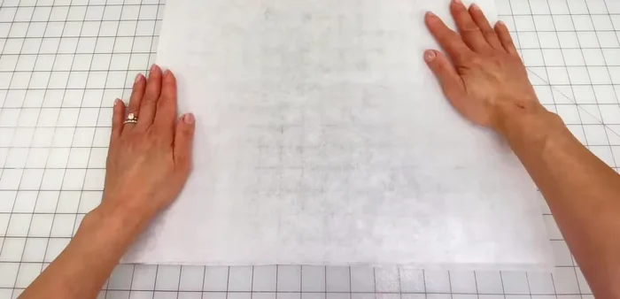 Add interfacing: Fuse interfacing to the wrong side of one set of crown and brim pieces.