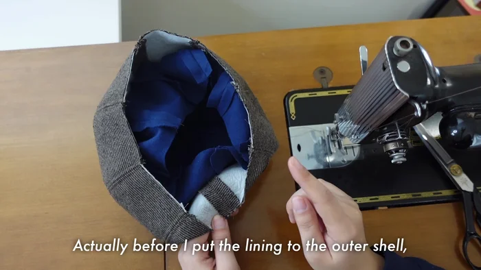 Sew the lining to the hat, starting from the center of the brim and working outwards.