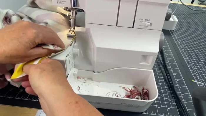 Attach the sleeves: Sew each sleeve to its armhole, matching notches. Put the sleeve on the feed dogs with the armhole on top for easier sewing.