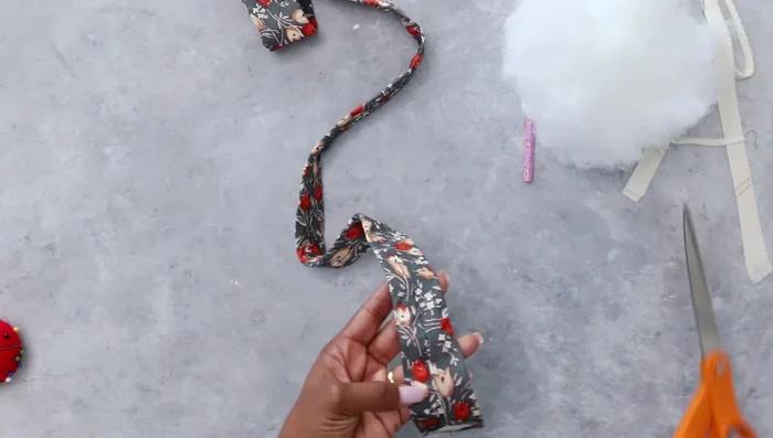 Remove the basting stitch from the narrow end of the tie to aid stuffing.