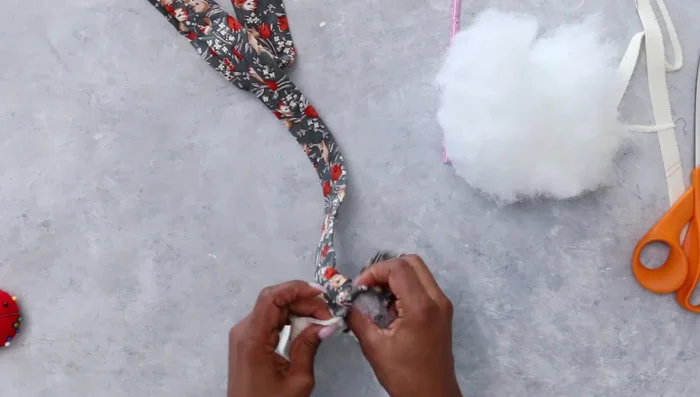 Stuff the snake body with batting using an unsharpened pencil to push and distribute the filling.