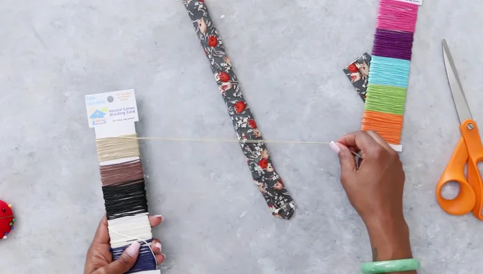 Wrap braiding cords around the tail end, securing with hot glue for texture and detail.