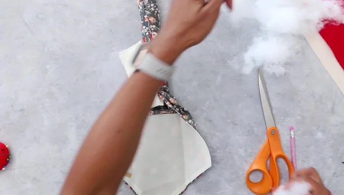 Stuff the snake's head with batting, avoiding overstuffing. Close and secure the opening.