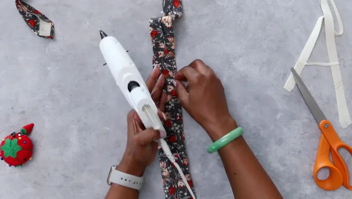 Remove the basting stitch from the narrow end of the tie to aid stuffing.