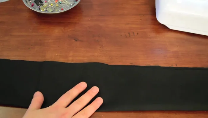 Fold the long ruffle piece in half, right sides together, and sew along the long edge, leaving an opening in the center.