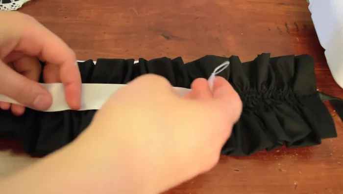 Sew a piece of lace over the stitching to cover the seam and optionally close the opening left in the headband.