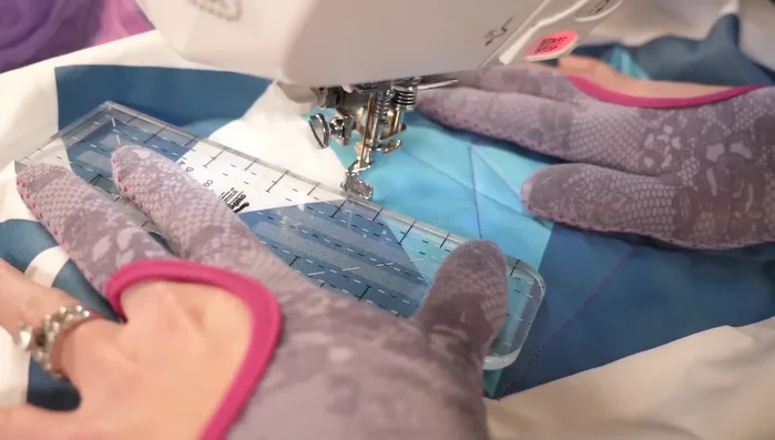 Repeat this for all chosen triangles, using a less dense stitch density in the mini-pinwheel to enhance its visual impact.