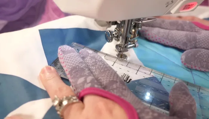 Repeat this for all chosen triangles, using a less dense stitch density in the mini-pinwheel to enhance its visual impact.