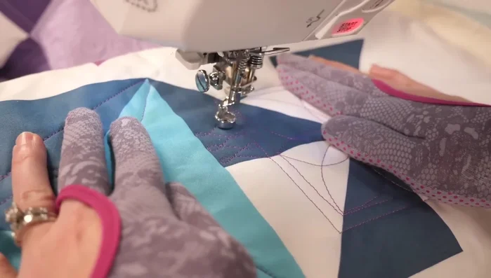 Fill the outer border with alternating designs (e.g., wishbones and ribbon candy) in different color segments.