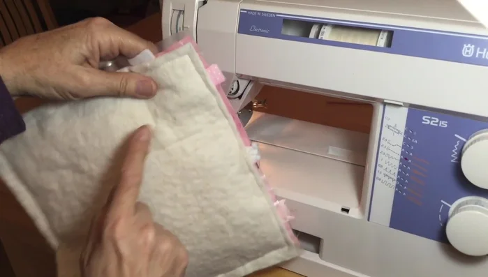 Stitch in the ditch to close the opening, securing rattles.