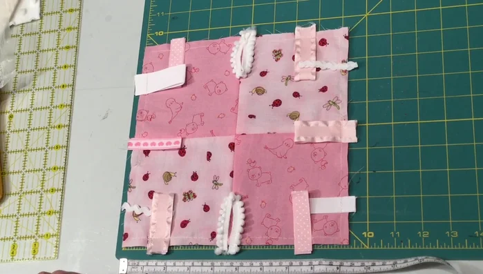 Cut the quilt batting, backing fabric, and crinkle plastic to the same size (slightly larger for crinkle plastic).