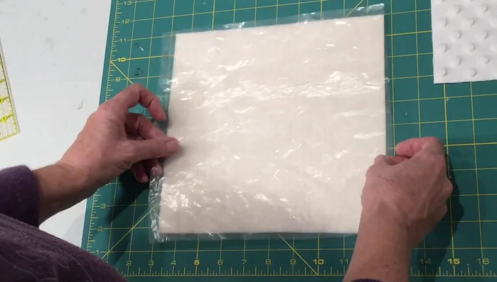 Sew around the perimeter, leaving a small opening for turning and inserting the rattles.